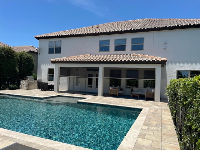 302 Coco Plum Ct, Oldsmar, FL 34677 - back of property featuring area for grilling, an outdoor hangout area, stucco siding, french doors, and an outdoor pool