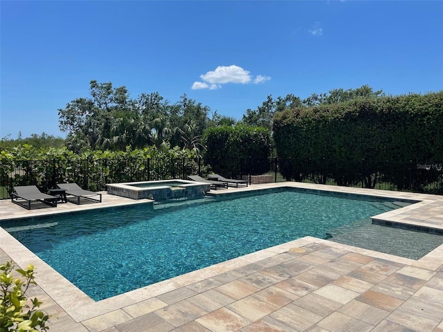 302 Coco Plum Ct, Oldsmar, FL 34677 - view of swimming pool featuring a patio area and a pool with connected hot tub