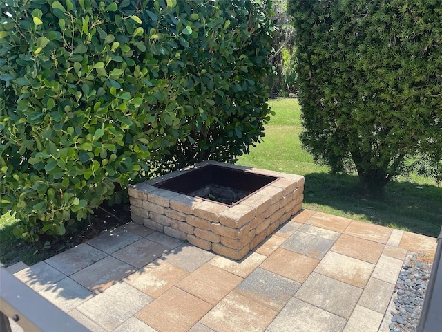 302 Coco Plum Ct, Oldsmar, FL 34677 - view of patio featuring a fire pit