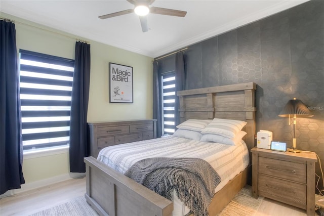 11721 Camden Park Dr, Windermere, FL 34786 - bedroom featuring crown molding, baseboards, light wood-style flooring, and ceiling fan