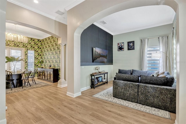 11721 Camden Park Dr, Windermere, FL 34786 - living area with wood finished floors, baseboards, crown molding, arched walkways, and ornate columns