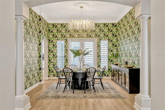 11721 Camden Park Dr, Windermere, FL 34786 - dining area with ornamental molding, decorative columns, light wood finished floors, a chandelier, and baseboards