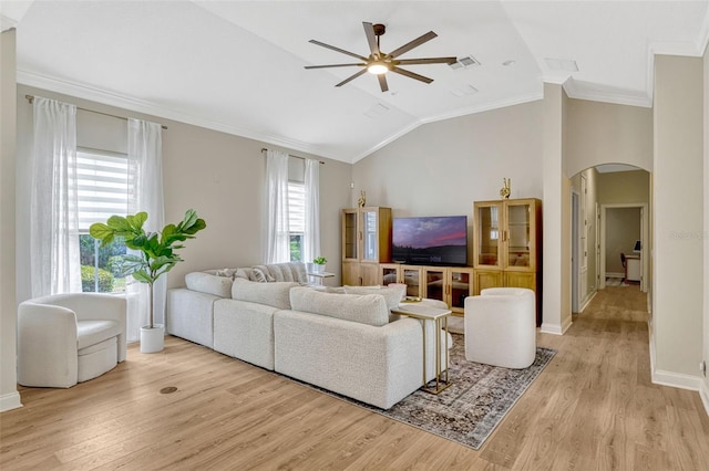 11721 Camden Park Dr, Windermere, FL 34786 - living area featuring arched walkways, vaulted ceiling, ceiling fan, light wood finished floors, and ornamental molding