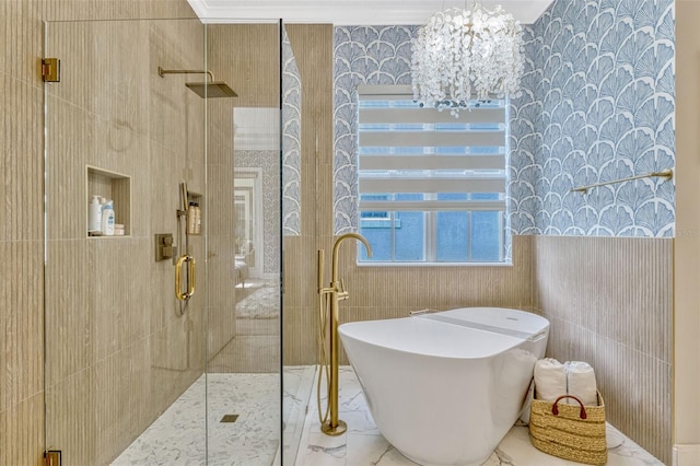 11721 Camden Park Dr, Windermere, FL 34786 - bathroom with a soaking tub, a shower stall, tile walls, a chandelier, and marble finish flooring