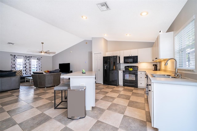 146 Hidden Pointe Ln, Groveland, FL 34736 - kitchen with black appliances, a sink, a breakfast bar area, open floor plan, and lofted ceiling