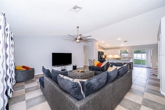 146 Hidden Pointe Ln, Groveland, FL 34736 - living area featuring vaulted ceiling, ceiling fan, baseboards, light tile patterned floors, and recessed lighting