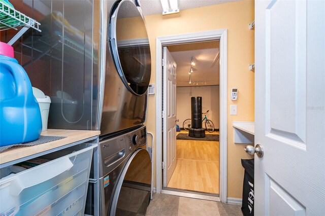 146 Hidden Pointe Ln, Groveland, FL 34736 - washroom with stacked washing machine and dryer