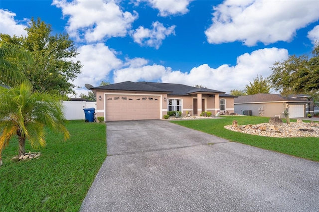 146 Hidden Pointe Ln, Groveland, FL 34736 - view of front of house featuring stucco siding, a garage, concrete driveway, and cooling unit