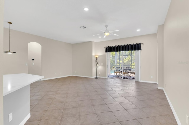 10417 Oakview Pointe Ter, Gotha, FL 34734 - unfurnished room with a ceiling fan, arched walkways, light tile patterned floors, baseboards, and recessed lighting