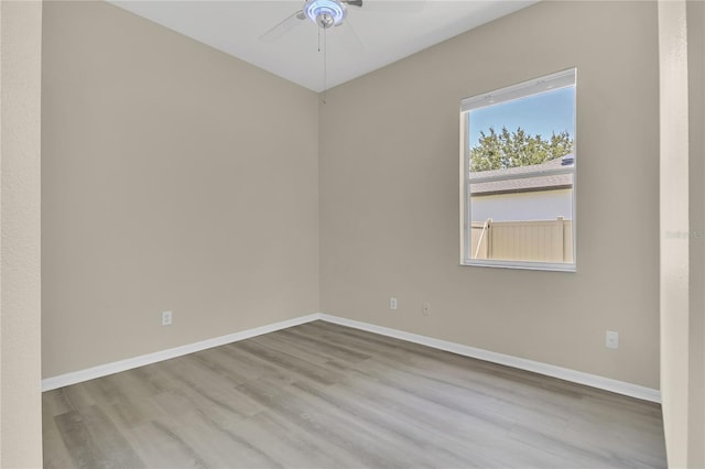 10417 Oakview Pointe Ter, Gotha, FL 34734 - unfurnished room with ceiling fan, wood finished floors, and baseboards