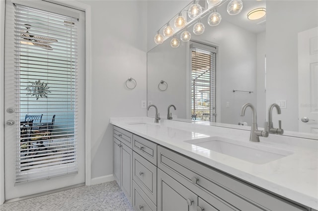 10417 Oakview Pointe Ter, Gotha, FL 34734 - bathroom with double vanity and baseboards