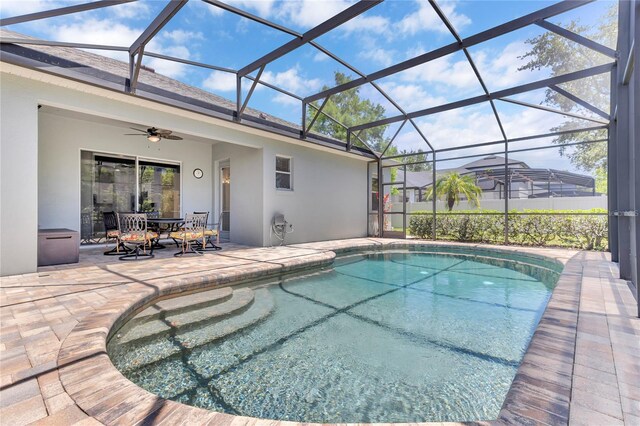10417 Oakview Pointe Ter, Gotha, FL 34734 - outdoor pool featuring a patio, a ceiling fan, and glass enclosure