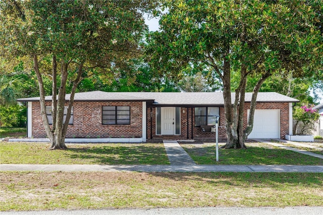 657 Lear Ter, Deltona, FL 32725 - ranch-style home featuring a garage, a front lawn, and brick siding