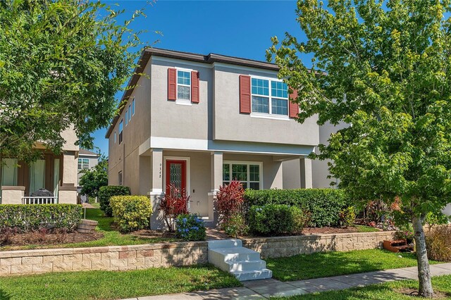 9348 Meadow Hunt Way, Winter Garden, FL 34787 - view of front facade featuring stucco siding and a porch