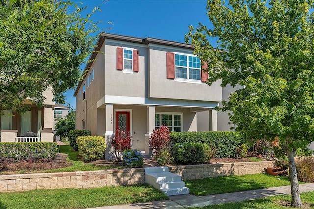 9348 Meadow Hunt Way, Winter Garden, FL 34787 - view of front facade featuring stucco siding and a porch