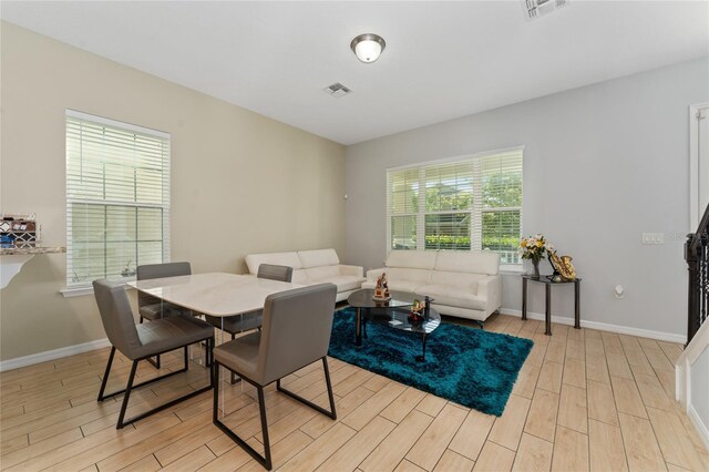 9348 Meadow Hunt Way, Winter Garden, FL 34787 - dining space featuring light wood-style floors and baseboards