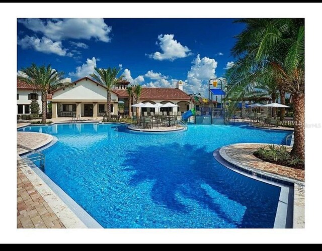 9348 Meadow Hunt Way, Winter Garden, FL 34787 - community pool featuring a patio