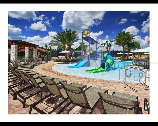 9348 Meadow Hunt Way, Winter Garden, FL 34787 - community playground featuring a water play area