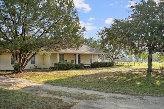 16017 Johns Lake Rd, Clermont, FL 34711 - view of front of house featuring covered porch and a front lawn