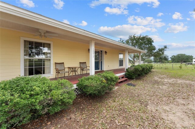 16017 Johns Lake Rd, Clermont, FL 34711 - back of house featuring ceiling fan and a porch