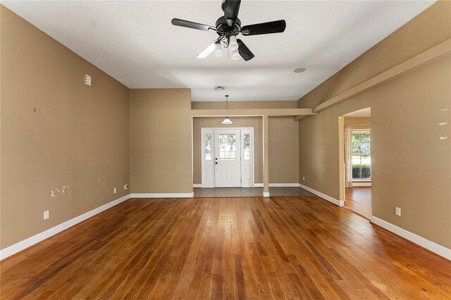 16017 Johns Lake Rd, Clermont, FL 34711 - empty room with hardwood / wood-style floors, baseboards, and a ceiling fan
