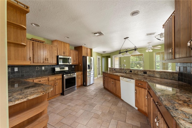 16017 Johns Lake Rd, Clermont, FL 34711 - kitchen featuring open shelves, appliances with stainless steel finishes, a sink, tasteful backsplash, and a ceiling fan