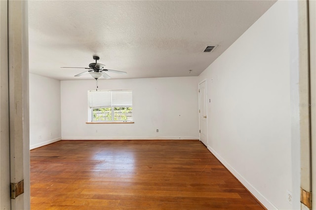 16017 Johns Lake Rd, Clermont, FL 34711 - spare room featuring wood finished floors, ceiling fan, baseboards, and a textured ceiling