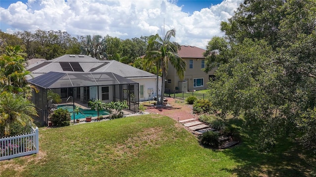 1913 Blue River Rd, Holiday, FL 34691 - rear view of property with a patio and glass enclosure