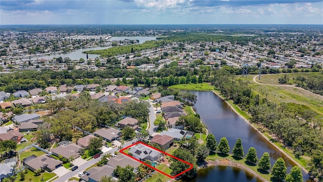 1913 Blue River Rd, Holiday, FL 34691 - aerial view of residential area featuring property boundaries highlighted and a nearby body of water