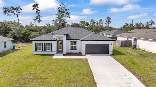 3211 SW 128th Street Rd, Ocala, FL 34473 - view of front facade with roof with shingles, a garage, stucco siding, and driveway