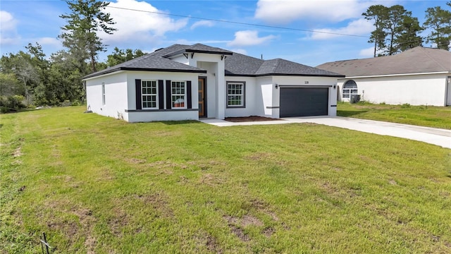 3211 SW 128th Street Rd, Ocala, FL 34473 - view of front of property featuring stucco siding, concrete driveway, an attached garage, a front yard, and a shingled roof