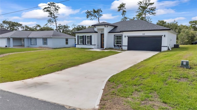 3211 SW 128th Street Rd, Ocala, FL 34473 - view of front of house featuring a garage, stucco siding, a shingled roof, a front yard, and driveway