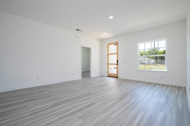 3211 SW 128th Street Rd, Ocala, FL 34473 - empty room with light wood-type flooring, recessed lighting, and baseboards