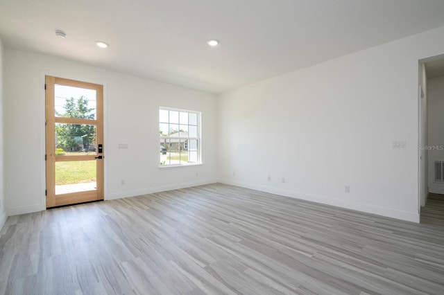 3211 SW 128th Street Rd, Ocala, FL 34473 - spare room featuring light wood-style flooring, baseboards, recessed lighting, and a smoke detector