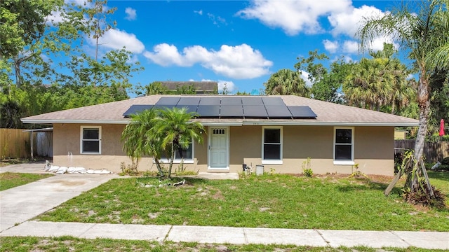 3431 Hunt Ln, Oviedo, FL 32765 - ranch-style house featuring stucco siding, a porch, and roof mounted solar panels