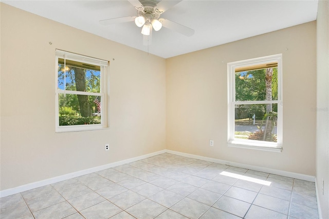 3431 Hunt Ln, Oviedo, FL 32765 - spare room featuring plenty of natural light, light tile patterned floors, ceiling fan, and baseboards