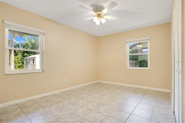 3431 Hunt Ln, Oviedo, FL 32765 - spare room with plenty of natural light, light tile patterned flooring, a ceiling fan, and baseboards