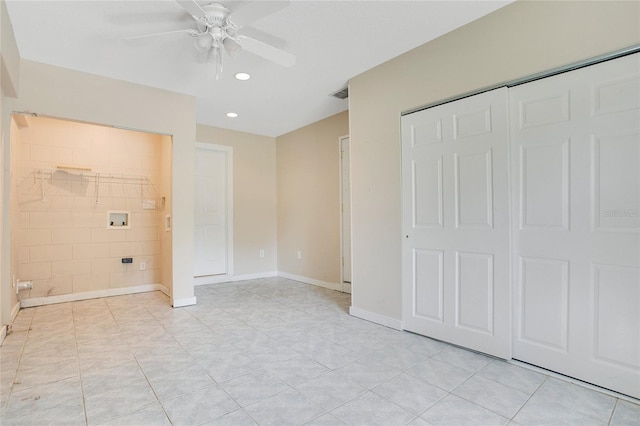 3431 Hunt Ln, Oviedo, FL 32765 - unfurnished bedroom featuring light tile patterned floors, a closet, recessed lighting, connected bathroom, and a ceiling fan