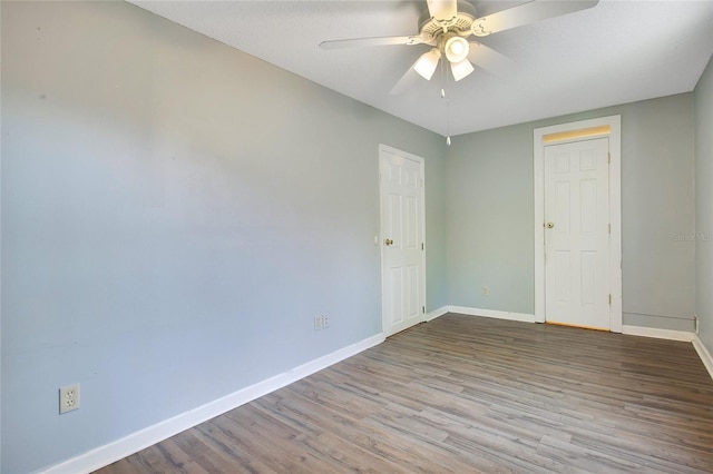 3431 Hunt Ln, Oviedo, FL 32765 - spare room featuring baseboards, wood finished floors, and a ceiling fan