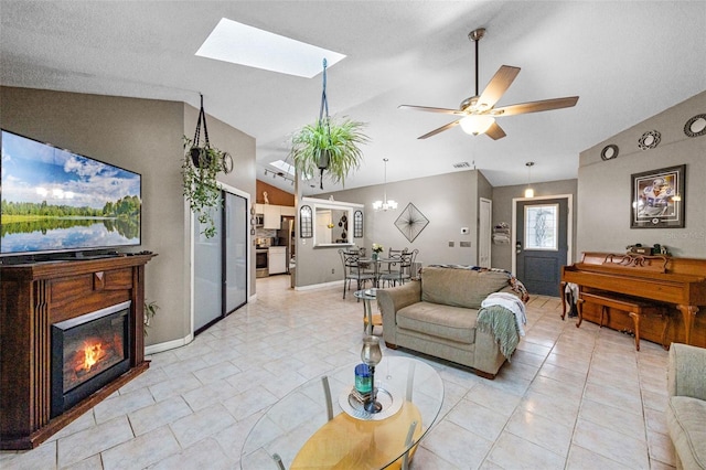 2916 Maldive Ct, Deltona, FL 32738 - living room with a glass covered fireplace, ceiling fan, a skylight, and high vaulted ceiling