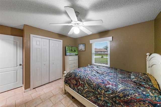 2916 Maldive Ct, Deltona, FL 32738 - bedroom with a closet, a textured ceiling, light tile patterned flooring, and ceiling fan