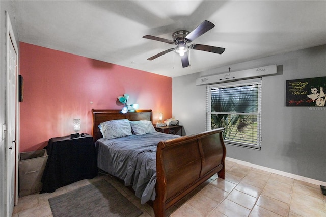 2916 Maldive Ct, Deltona, FL 32738 - bedroom featuring light tile patterned floors, a ceiling fan, and baseboards