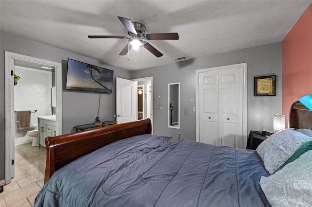 2916 Maldive Ct, Deltona, FL 32738 - bedroom with a ceiling fan, ensuite bath, light tile patterned flooring, and a closet