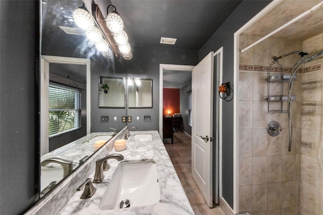2916 Maldive Ct, Deltona, FL 32738 - bathroom with a tile shower and double vanity