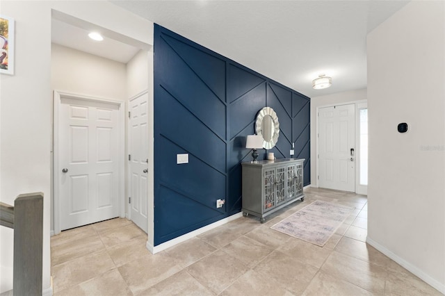 2401 Oxmoor Dr, Deland, FL 32724 - foyer entrance featuring baseboards and light tile patterned floors