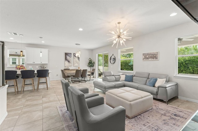 2401 Oxmoor Dr, Deland, FL 32724 - living room featuring a chandelier, recessed lighting, baseboards, and light tile patterned flooring