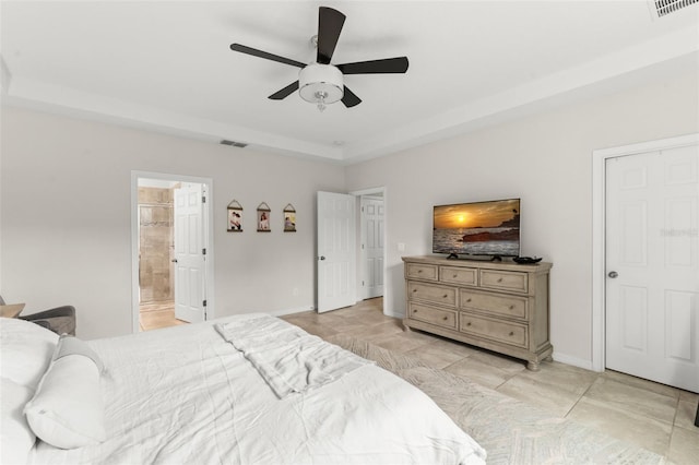 2401 Oxmoor Dr, Deland, FL 32724 - bedroom with light tile patterned floors, ensuite bath, baseboards, and ceiling fan