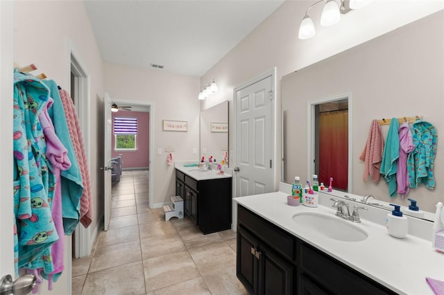 2401 Oxmoor Dr, Deland, FL 32724 - bathroom featuring two vanities and tile patterned floors