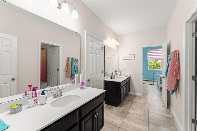 2401 Oxmoor Dr, Deland, FL 32724 - full bathroom with two vanities, tile patterned floors, and baseboards