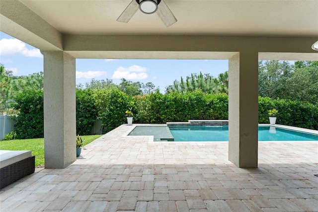 2401 Oxmoor Dr, Deland, FL 32724 - view of swimming pool featuring ceiling fan, a patio, and view of wooded area
